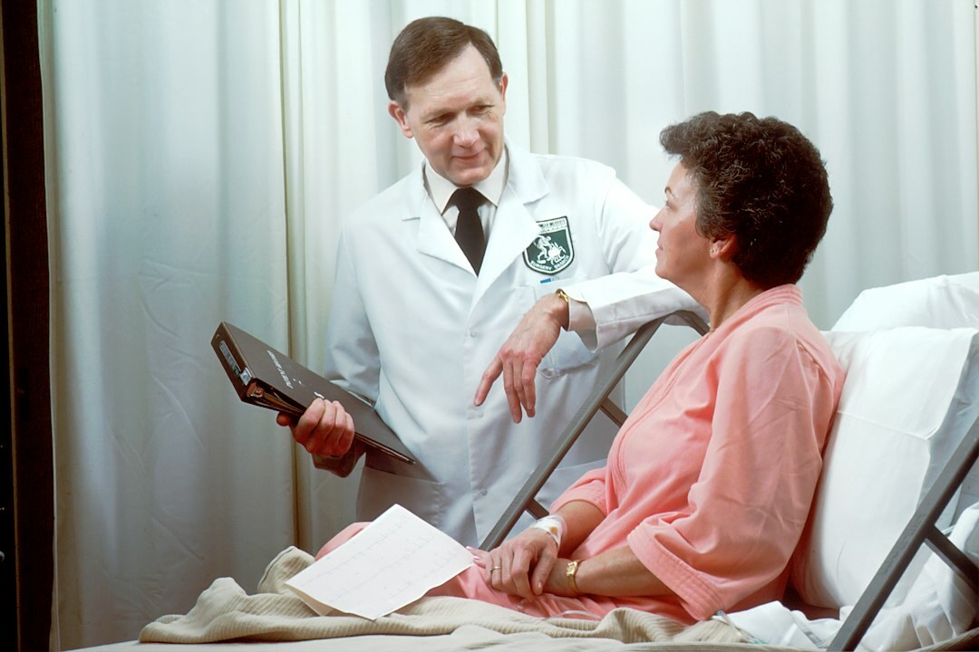 doctor discussing insurance with patient