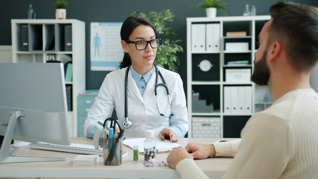 doctor consulting patient in office