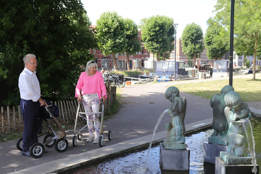 elderly couple walking outdoors